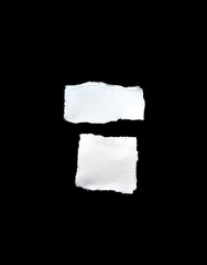 Scrap of white paper on black background