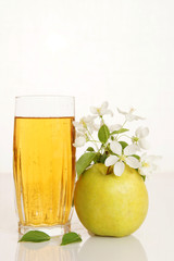 Glass full of fresh juice with ripe green apple