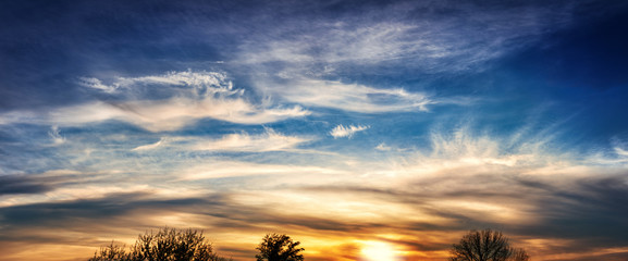 sunset sky  with dramatic clouds - panorama