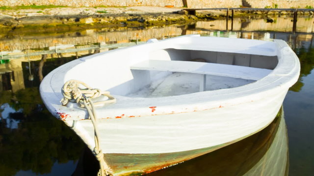 empty rowboat in porto colom (majorca - spain)