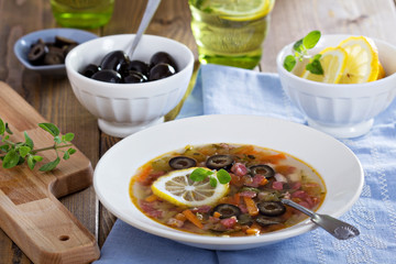 Soup with meat, sausage and olives
