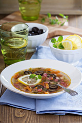 Soup with meat, sausage and olives