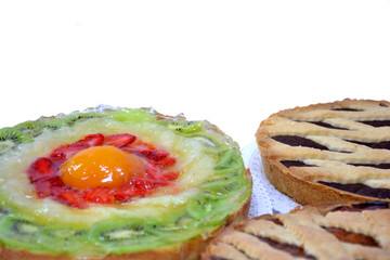 Composition of strawberry pie and chocolate tarts