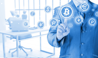 Choosing bitcoins, businessman pressing touch screen button.
