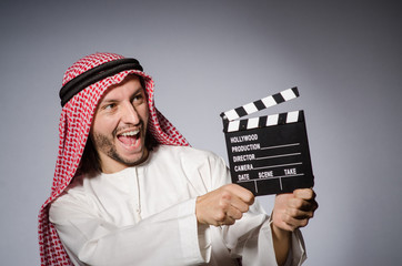 Arab with movie clapper board
