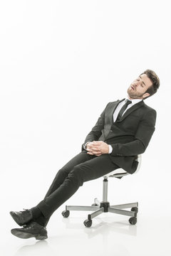 man in suit asleep on a chair  on isolated background