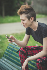 young lesbian stylish hair style woman using smart phone