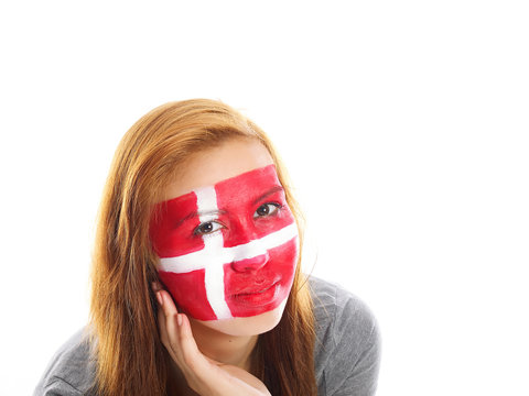 smiling girl with danish flag painted on her face