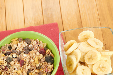 Plate with raw oatmeal on wooden table.