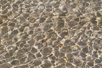 pool rippled water with sunny reflections