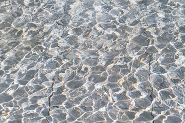 pool rippled water with sunny reflections