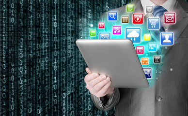 Business man use tablet pc with colorful application icons