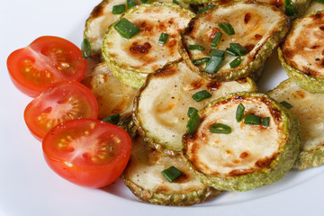 fried zucchini with fresh cherry tomatoes. top view