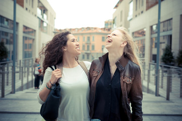 blonde and brunette beautiful stylish young women