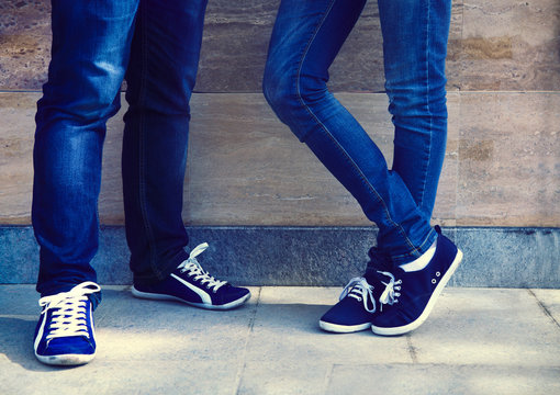 Close Up Of A Teen Couple Wearing Shoes