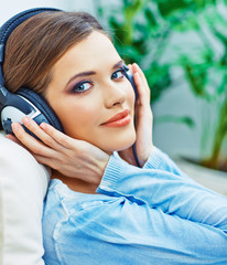 Beautiful teenager girl listening music.