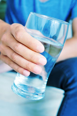 young man with a glass of water