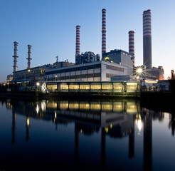 Obraz premium Electricity power plant near a river