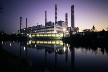 Naklejka premium Electricity power plant near a river