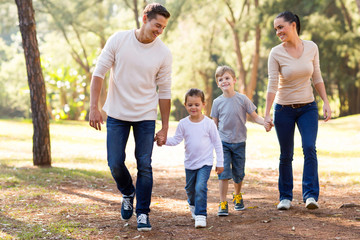 family walking in park - 65438378