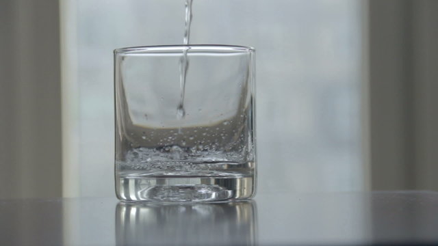 Pouring water glass of clean water, with sound, dirty polluted