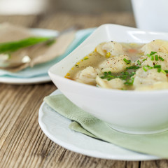 Dish of savory pork tortellini in broth pelmeni russian