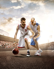 Basketball player in action on background of sky and crowd