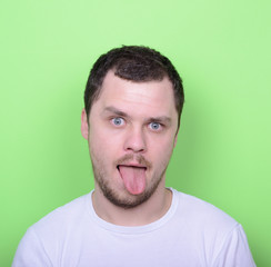 Obraz premium Portrait of man with funny face against green background