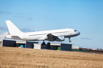 Fototapeta na wymiar Passenger airliner taking off at an airport