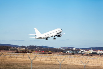Fototapeta na wymiar Passenger airliner taking off at an airport