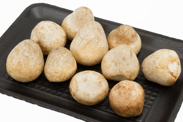 Straw Mushroom in foam pack, isolated on white background