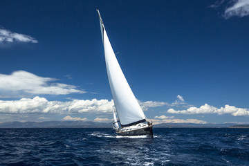Fototapeta na wymiar Yachting, sailing regatta. Luxury yachts.