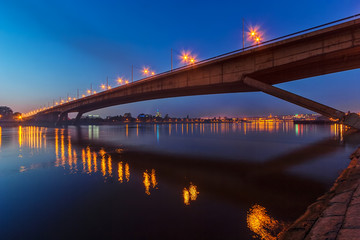 Bridge across river at night