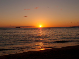 Sunset over ocean on Kaimana Beach