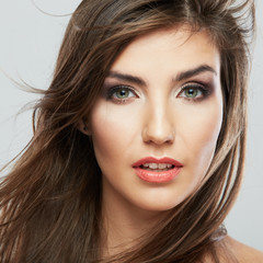 Obraz premium Woman face with hair motion on white background isolated