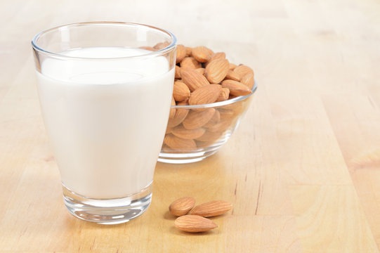 Glass of Almond milk on a table.