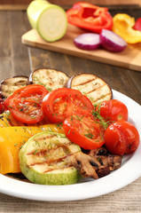 Delicious grilled vegetables on plate on table close-up