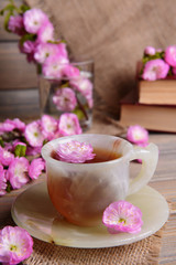 Beautiful fruit blossom with cup of tea