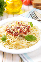 Pasta with tomato sauce on plate on table close-up