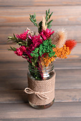 Beautiful bouquet of bright flowers in jar