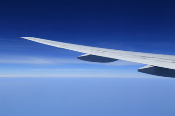 airplane wing above sky