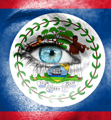 Woman face painted with flag of Belize