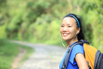 Obraz premium hiking woman on forest trail 