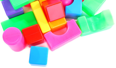 Colorful plastic toys isolated on white