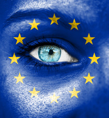 Woman face painted with flag of European Union
