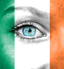 Woman face painted with flag of Ireland