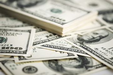 Stack of one hundred dollar bills close-up.