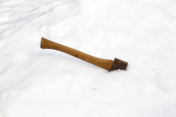 Ax head buried in snow
