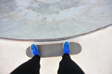 skateboarder on skatepark bowl © lzf