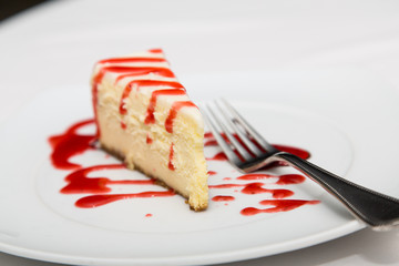 Slisce of Cheesecake with Strawberry Sauce